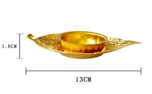Detail of leaf-shaped gold incense burner tray showing 13cm length and 1.8cm height