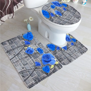 Detailed view of 3-piece bathroom mat set with blue roses on grey brick texture