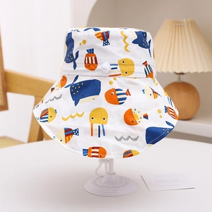 Close-up of kids sun hat with sea life prints including whales and adjustable chin strap