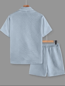 Detail of light blue basket weave texture on men's short sleeve knit shirt and shorts set
