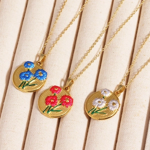 Pendentifs tulipes vintage en émail sur des chaînes dorées en acier titane