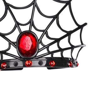 Close-up of black spider web crown featuring a large faceted red gemstone detail