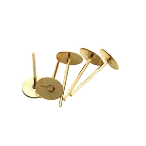 Five gold-plated flat head earring studs for DIY jewelry making on white background