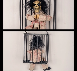 Detailed view of Halloween skeleton prisoner in a cage with bloody rags and long hair