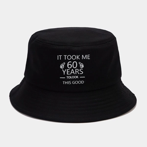 Detail of 60th birthday black cotton bucket hat with white text and thumb icon