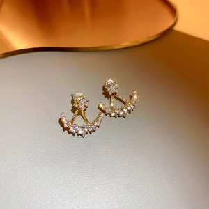 Exquisite gold-colored star and crescent stud earrings with sparkling clear zircons