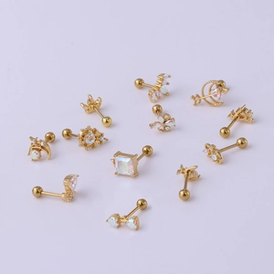 Golden stainless steel cartilage studs with colorful zircons in moon and star shapes