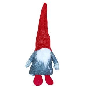 Handmade Christmas gnome with a red knit hat and white beard for holiday decoration