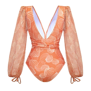 Detail of V-neck one-piece swimsuit featuring orange shell prints and mesh long sleeves