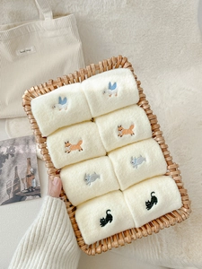 Close-up of assorted rolled thermal fleece socks with cute animal embroidery in a basket