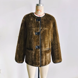 Brown faux fur jacket with black leather trim and square buckles on a mannequin