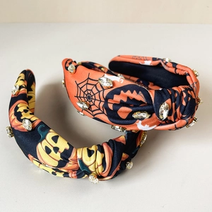 Halloween knotted headbands with pumpkin and spider web patterns and rhinestone accents