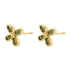 Detail of golden butterfly earrings with green crystals and polished metal finish