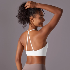 Detailed back view of white yoga sports bra with double criss-cross thin straps design