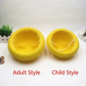Matching yellow straw sun hats for parent and child with protective chin straps