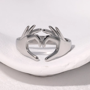 Polished silver adjustable stainless steel open ring with a creative heart gesture design