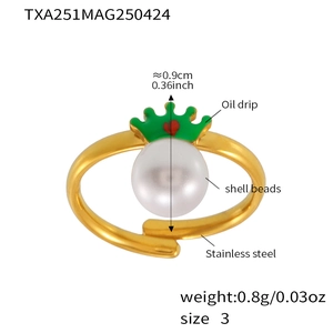 Detail of kids stainless steel ring with crown shell bead and size markings