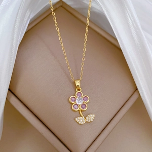 Elegant 18K gold-plated flower necklace with pink gemstones and sparkling zircon accents