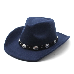 Detail of silver embossed metal conchos on the black leather band of this navy wool hat