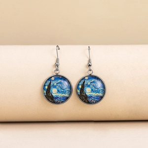 Detailed close-up of Van Gogh Starry Night art glass dome earrings with bronze hooks