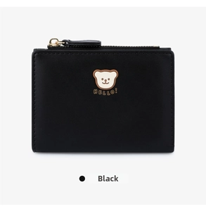 Close-up of black leather wallet featuring a cute bear pattern and gold metal zipper