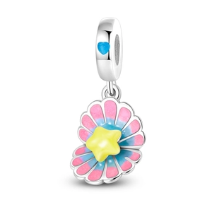 Macro shot of seashell charm with yellow star and blue heart in colorful enamel finish
