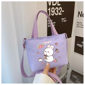 Detail of cute rabbit print on a purple canvas kids shoulder bag with shoulder strap