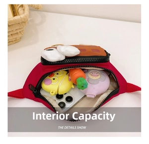 Detail showing internal capacity of the red cartoon kids waist bag with big eyes