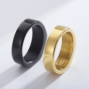 Minimalist wide band stainless steel rings in gold and black with polished finish