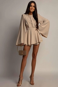 Detailed view of beige long sleeve dress with flared cuffs and tie waist belt