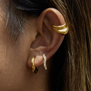 Chic 18k gold plated stainless steel ear cuff set with rhinestones on model's ear