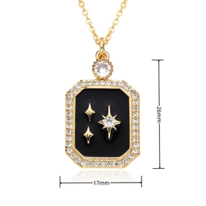 Detail shot showing a 26mm x 17mm gold plated rectangle pendant with star patterns