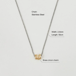 Detail showing 50cm stainless steel chain and brass zircon charms of the necklace