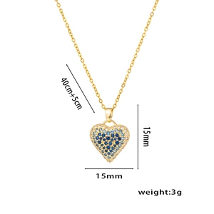 Detail view of heart pendant with blue stones, measuring 15mm with a 45cm chain length