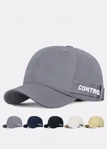 Detail view of cotton baseball caps showing embroidered CONTROL text and color selection