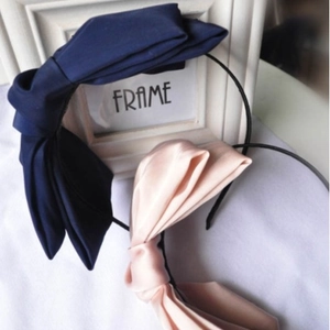Exaggerated double-layered satin bow headbands in navy blue and light pink
