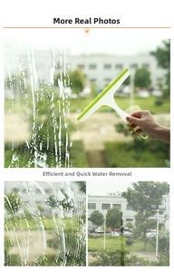 Detail showing bright green rubber squeegee cleaning soapy glass window effectively