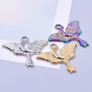 Stainless steel moon and butterfly charms in silver, gold, and iridescent finishes