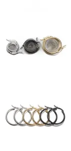 Set of stainless steel hoop earrings in silver, black, and gold finishes with hinge closure