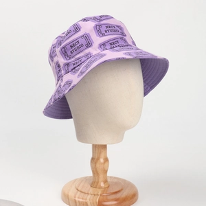 Macro detail of purple bucket hat featuring street style ticket print and necy studio text