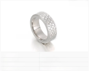 Detail view of 8mm wide stainless steel ring with unique hammered texture and silver finish