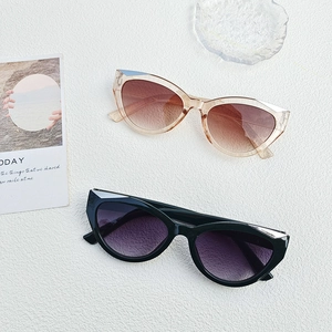 Y2K cat-eye sunglasses with gradient lenses and stylish brown and black frames