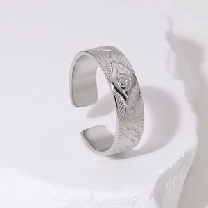 Silver Eye of Horus stainless steel adjustable open ring on a white marble stone stand