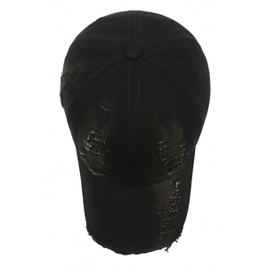 Vintage distressed black baseball cap with ripped denim style and street fashion look