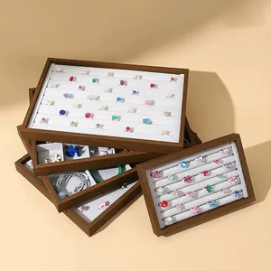 Stackable black walnut wood jewelry tray with white velvet slots for rings and earrings