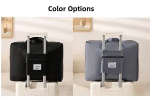 Detail of travel bags in black and gray showing the convenient trolley sleeve attachment