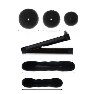 Hair styling tool set including various sizes of bun makers and sponge braiding accessories
