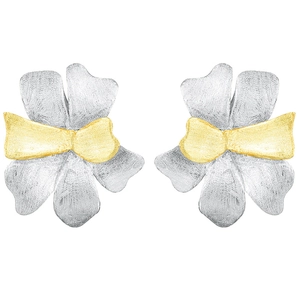 Detail of handmade two-tone floral petal studs with brushed matte silver and gold textures