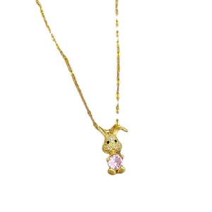 Pink rabbit zircon pendant necklace in gold plated stainless steel on white background