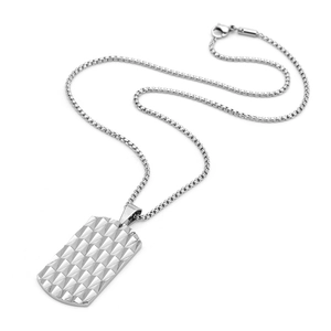 Detail of silver titanium steel rectangular pendant with geometric pyramid texture and box chain